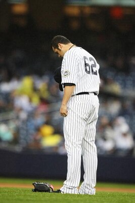 NEW YORK - JUNE 18:  Joba Chamberlain #62 of The New York Yankees prays before pitching against The Washington Nationals during their game on June 18th, 2009 at Yankee Stadium in the Bronx Borough of New York.  (Photo by Al Bello/Getty Images)