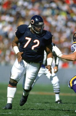 CHICAGO - SEPTEMBER 23:  William Perry #72 of the Chicago Bears runs through the Minnesota Vikings defense during a game at the Soldier Field on September 23, 1990 in Chicago, Illinois.  The Bears won 19-16.  (Photo by Jonathan Daniel/Getty Images)
