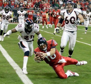 HOUSTON - DECEMBER 13:  Sage Rosenfels #18 of the Houston Texans dives for a touchdown during the the NFL game against Hamza Abdullah #21 and John Engelberger #60 of the Denver Broncos at Reliant Stadium on December 13, 2007 in Houston, Texas.   (Photo by