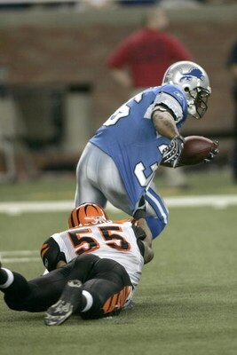 DETROIT, MI - AUGUST 9: Running back Aveion Cason #36 of the Detroit Lions runs with the football as Ahmad Brooks #55 tries to slow him down against the Cincinnati Bengals at Ford Field on August 9, 2007 in Detroit, Michigan. The Lions defeated the Bengal