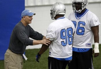 ALLEN PARK, MI - MAY 03:  Head coach Rod Marinelli of the Detroit Lions works with Landon Cohen #98 and Andre Fluellen #96 during rookie training camp at the Detroit Lions Headquarters and Training Facility on May 3, 2008 in Allen Park, Michigan.  (Photo 