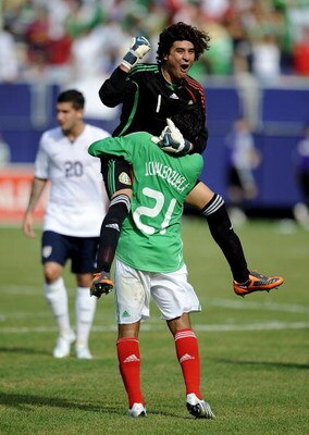 EAST RUTHERFORD, NJ - JULY 26:  Goalkeeper Guillermo Ochoa #1 and Juan Carlos Valenzuela #21 of Mexico celebrate 5-0 win over the United States in the CONCACAF Gold Cup Championship match at Giants Stadium on July 26, 2009 in East Rutherford, New Jersey. 