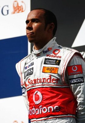 BUDAPEST, HUNGARY - JULY 26:  Lewis Hamilton of Great Britain and McLaren Mercedes celebrates on the podium after winning the Hungarian Formula One Grand Prix at the Hungaroring on July 26, 2009 in Budapest, Hungary.  (Photo by Paul Gilham/Getty Images)