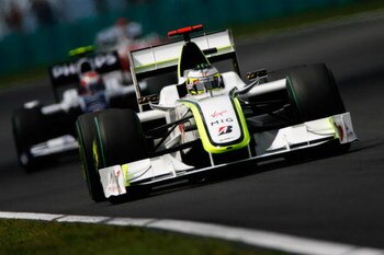 BUDAPEST, HUNGARY - JULY 26:  Jenson Button of Great Britain and Brawn GP holds off the challenge of Kazuki Nakajima of Japan and Williams as they battle on the track during the Hungarian Formula One Grand Prix at the Hungaroring on July 26, 2009 in Budap
