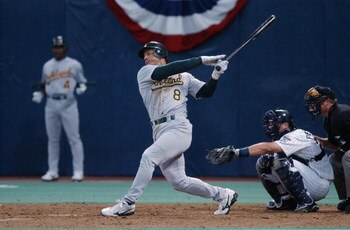 MINNEAPOLIS, MN - OCTOBER 4:  Randy Velarde #8 of the Oakland A's swings at the pitch during the American League Division Series against the Minnesota Twins on October 4, 2002 at the Hubert H Humphrey Dome in Minneapolis, Minnesota.  (Photo by Matthew Sto