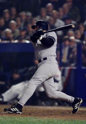 26 Oct 2000:  Luis Sojo of the New York Yankees hits the game winning single in the ninth inning against the New York Mets during Game 5 of the World Series at Shea Stadium in Flushing, New York. <DIGITAL IMAGE> Mandatory Credit: Jed Jacobsohn/ALLSPORT