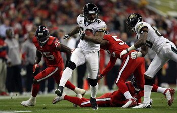 HOUSTON - DECEMBER 01:  Running back Fred Taylor #28 of the Jacksonville Jaguars runs the ball against the Houston Texans at Reliant Stadium on December 1, 2008 in Houston, Texas.  (Photo by Ronald Martinez/Getty Images)
