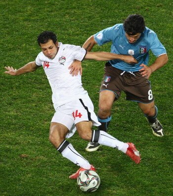 JOHANNESBURG, SOUTH AFRICA - JUNE 18: Sayed Mowwad of Egypt battles with Gennaro Gattuso of Italy during the FIFA Confederations Cup match between Egypt and Italy at Ellis Park Stadium on June 18, 2009 in Johannesburg, South Africa.  (Photo by Laurence Gr