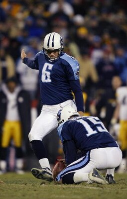 NASHVILLE, TN - JANUARY 11:  Joe Nedney #6 of the Tennessee Titans eyes the ball as he kicks from the hold of Craig Hentrich #15 against the Pittsburgh Steelers at the Coliseum on January 11, 2003 in Nashville, Tennessee. TheTitans won 34-31 in overtime t