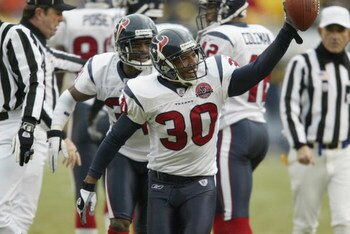 PITTSBURGH - DECEMBER 8 : Jason Simmons #30 of the Houston Texans recovers a fumble against the Pittsburgh Steelers on December 8, 2002 at Heinz Field in Pittsburgh, Pennsylvania.  The Texans beat the Steelers 24-6. (Photo by Tom Pidgeon/Getty Images)