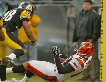 PITTSBURGH - NOVEMBER 30:  Chris Hope #28 of the Pittsburgh Steelers makes a late hit on Matt Schobel #89 of the Cincinnati Bengals after Schobel caught the winning touchdown pass on November 30, 2003 at Heinz Field in Pittsburgh, Pennsylvania. The Bengal