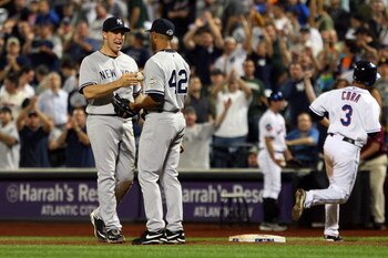 NEW YORK - JUNE 28:  Mariano Rivera #42 of the New York Yankees receives the game ball from teammate Mark Teixeira #25 after the final out against Alex Cora #3 of the New York Mets on June 28, 2009 at Citi Field in the Flushing neighborhood of the Queens 