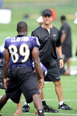 WESTMINSTER, MD - JULY 28:  Head coach John Harbaugh of the Baltimore Ravens talks with Mark Clayton #89 during training camp at McDaniel College on July 28, 2009 in Westminster, Maryland.  (Photo by Greg Fiume/Getty Images)