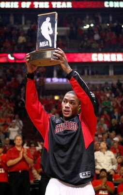 CHICAGO - APRIL 23: Derrick Rose #1 of the Chicago Bulls holds the NBA Rookie of the Year trophy in a pre-game ceremony before the Bulls take on the Boston Celtics in Game Three of the Eastern Conference Quarterfinals during the 2009 NBA Playoffs at the U