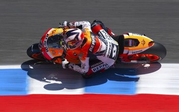 MONTEREY, CA - JULY 4:  Andrea Dovizioso of Italy rides the #4 Repsol Honda during qualifying for the Moto GP Red Bull U. S. Grand Prix at the Mazda Raceway Laguna Seca on July 4, 2009 in Monterey, California.  (Photo by Robert Laberge/Getty Images)