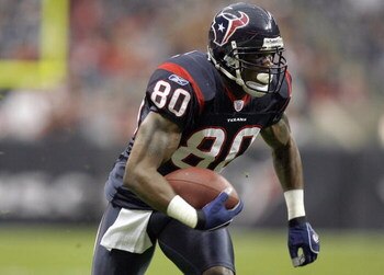 HOUSTON - DECEMBER 24:  Andre Johnson #80 of the Houston Texans carries the ball during the game against the Indianapolis Colts on December 24, 2006 at Reliant Stadium in Houston, Texas. The Texans defeated the Colts 27-24. (Photo by Chris Graythen/Getty 