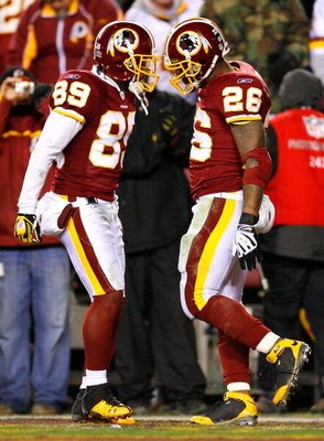 LANDOVER, MD - DECEMBER 21:  Running back Clinton Portis #26 of the Washington Redskins celebrates scoring a touchdown with teammate Santana Moss #89 during the game against the Philadelphia Eagles on December 21, 2008 at FedEx Field in Landover, Maryland