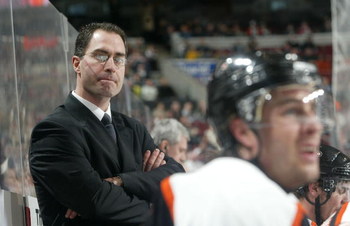 PHILADELPHIA - JANUARY 30:  Head coach John Stevens of the Philadelphia Flyers looks on against the Tampa Bay Lightning on January 30, 2007 at the Wachovia Center in Philadelphia, Pennsylvania. The Lightning defeated the Flyers 4-3 in a shoot out.  (Photo
