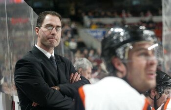 PHILADELPHIA - JANUARY 30:  Head coach John Stevens of the Philadelphia Flyers looks on against the Tampa Bay Lightning on January 30, 2007 at the Wachovia Center in Philadelphia, Pennsylvania. The Lightning defeated the Flyers 4-3 in a shoot out.  (Photo