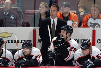 PHILADELPHIA - NOVEMBER 2:  Head coach John Stevens of the Philadelphia Flyers looks on from behind the bench against the Tampa Bay Lightning on November 2, 2006 at the Wachovia Center in Philadelphia, Pennsylvania.  The Lightning won 5-2.  (Photo by Chri