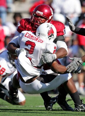 BLOOMINGTON, IN - NOVEMBER 3:  Jammie Kirlew #57 of the Indiana Hoosiers tackles Frank Edmonds #2 of the Ball State Cardinals during the game at Memorial Stadium November 3, 2007 in Bloomington, Indiana.  (Photo by Andy Lyons/Getty Images)
