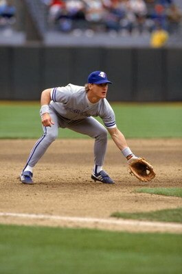 OAKLAND, CA - 1990:  Kelly Gruber #17 of the Toronto Blue Jays readies for a play as he fields his position during a game against the Oakland Athletics in 1990 at Oakland-Alameda County Coliseum in Oakland, California.  (Photo by Otto Greule Jr/Getty Imag