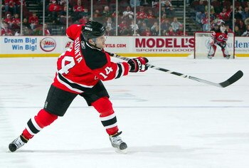 NEWARK, NJ - APRIL 11:  Brian Gionta #14 of the New Jersey Devils skates against the Carolina Hurricanes at the Prudential Center on April 11, 2009 in Newark, New Jersey. The Devils defeated the Hurricanes 3-2.  (Photo by Jim McIsaac/Getty Images)