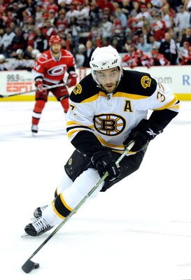 RALEIGH, NC - MAY 12:  Patrice Bergeron #37 of the Boston Bruins moves the puck against the Carolina Hurricanes during Game Six of the Eastern Conference Semifinal Round of the 2009 Stanley Cup Playoffs on May 12, 2009 at the RBC Center in Raleigh, North 