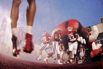 FAYETTEVILLE, AR - SEPTEMBER 02:  Tailback Darren McFadden #5 of the Arkansas Razorbacks turns around to retrieve his helmet after hitting his head on the roof of the hog's mouth while running onto the field for a game against the University of Southern C