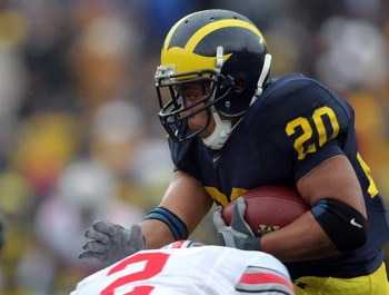 ANN ARBOR, MI - NOVEMBER 17:  Mike Hart #20 of the Michigan Wolverines is hit by Malcolm Jenkins #2 of The Ohio State Buckeyes during the third quarter at Michigan Stadium on November 17, 2007 in Ann Arbor, Michigan.  The Buckeyes won 14-3.  (Photo by Har