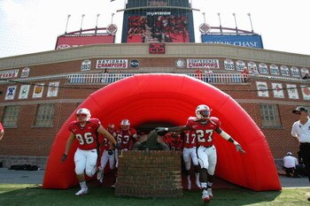 COLLEGE PARK, MD - SEPTEMBER 17:  Players from the University of Maryland Terrapins touch a turtle statue as they enter the field prior to a game against West Virginia University Mountaineers at Byrd Stadium on September 17, 2005 in College Park, Maryland