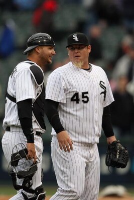CHICAGO - APRIL 29:  A.J. Pierzynski #12 meets with Bobby Jenks #45 of the Chicago White Sox during the game against the Seattle Mariners on April 29, 2009 at U.S. Cellular Field in Chicago, Illinois. (Photo by Jonathan Daniel/Getty Images) 