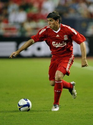 BANGKOK, THAILAND - JULY 22:  Emiliano Insua of Liverpool in action during a pre-season friendly match againts Thailand at the Rajamangala National Stadium on July 22, 2009 in Bangkok, Thailand.  (Photo by Victor Fraile/Getty Images)