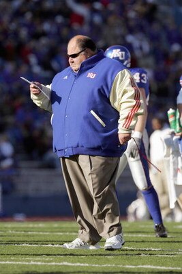 LAWRENCE, KS - NOVEMBER 18:  Mark Mangino  of the Kansas Jayhawks stands on the field during the game against the Kansas State Wildcats on November 18, 2006 at Memorial Stadium in Lawrence, Kansas.  Kansas won 39-20.  (Photo by Brian Bahr/Getty Images)