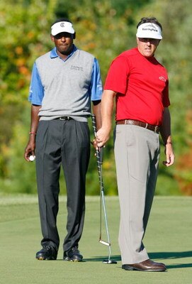 NORTON, MA - SEPTEMBER 1:  Vijay Singh and Phil Mickelson watch Mickelson's tee shot during the second round of Deutsche Bank Championship, the second event of the new PGA TOUR Playoffs for the FedExCup at TPC Boston on September 1, 2007 in Norton, Massac