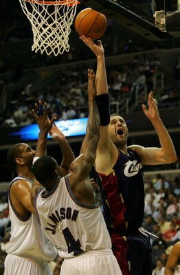 WASHINGTON - APRIL 30:  Zydrunas Illgauskas #11 of the Cleveland Cavaliers shoots the ball over Antawn Jamison #4 in Game Four of the Eastern Conference Quarterfinals during the 2007 NBA Playoffs on April 30, 2007 at Verizon Center in Washington, DC. NOTE