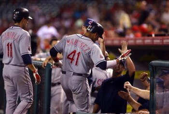 ANAHEIM, CA - JULY 27:  Victor Martinez #41 of the Cleveland Indians receives high fives from the dugout after hitting a three-run home run in the ninth inning against the Los Angeles Angels of Anaheim at Angel Stadium on July 27, 2009 in Anaheim, Califor