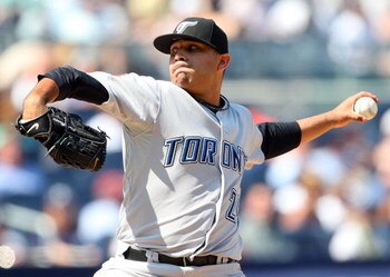 NEW YORK - JULY 06:  Ricky Romero #24 of the Toronto Blue Jays pitches against the New York Yankees on July 6, 2009 at Yankee Stadium in the Bronx borough of New York City.  (Photo by Jim McIsaac/Getty Images)