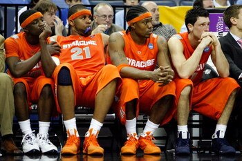 MEMPHIS, TN - MARCH 27:  (L-R) Jonny Flynn #10, Arinze Onuaku #21, Paul Harris #11 and Andy Rautins #1 of the Syracuse Orange sit on the bench late in the second half before losing to the Oklahoma Sooners during the NCAA Men's Basketball Tournament South 