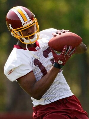 ASHBURN, VA - MAY 02:  Washington Redskins second round draft pick, wide receiver Malcolm Kelly #12, takes part in drills during the first day of mini-camp at Redskins Park May 2, 2008 in Ashburn, Virginia.  (Photo by Win McNamee/Getty Images)