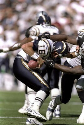 11 Oct 1998: Ryan Leaf #16 of the San Diego Chargers is sacked after hiking the ball during the game against the Oakland Raiders at Oakland Coliseum in Oakland, California.The Raiders defeated the Chargers 7-6. Mandatory Credit: David Taylor  /Allsport