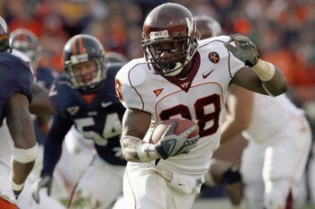 CHARLOTTESVILLE, VA - NOVEMBER 24: Tailback Branden Ore #28 of the Virginia Tech Hokies carries the ball  during game against the Virginia Cavaliers at Scott Stadium on November 24, 2007 in Charlottesville, Virginia. Virginia Tech defeated Virginia 33-21.