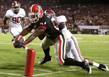 ATHENS, GA - SEPTEMBER 27:  Running back Knowshon Moreno #24 of the Georgia Bulldogs scoes a touchdown past linebacker Rashad Johnson #49 and defensive lineman Milton Talbert #90 of the Alabama Crimson Tide at Sanford Stadium on September 27, 2008 in Athe
