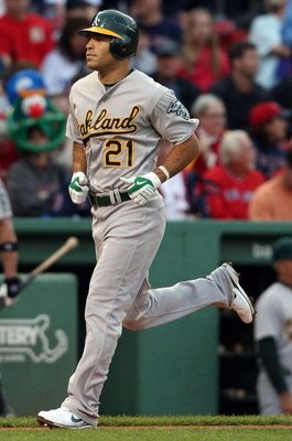 BOSTON - JULY 07:  Scott Hairston #21 of the Oakland Athletics heads for home plate after his solo home run in the first inning off a pitch by Josh Beckett of the Boston Red Sox non July 7, 2009 at Fenway Park in Boston, Massachusetts.  (Photo by Elsa/Get