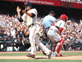 SAN FRANCISCO - AUGUST 02:  Freddy Sanchez #21 of the San Francisco Giants celebrates after scoring in the fifth inning against the Philadelphia Phillies on an error by Ryan Howard during a Major League Baseball game at AT&T Park on August 2, 2009 in San 