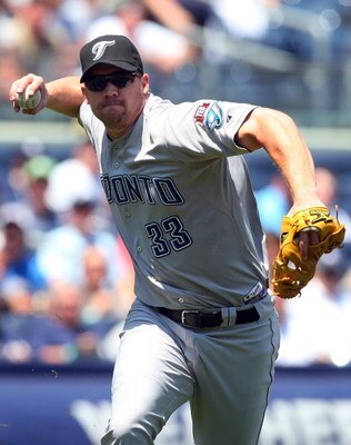 NEW YORK - JULY 06:  Scott Rolen #33 of the Toronto Blue Jays throws to first base for an out against the New York Yankees on July 6, 2009 at Yankee Stadium in the Bronx borough of New York City.  (Photo by Jim McIsaac/Getty Images)