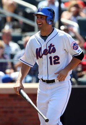 NEW YORK - JULY 12:  Jeff Francoeur #12 of the New York Mets looks on against the Cincinnati Reds on July 12, 2009 at Citi Field in the Flushing neighborhood of the Queens borough of New York City.  (Photo by Jim McIsaac/Getty Images)