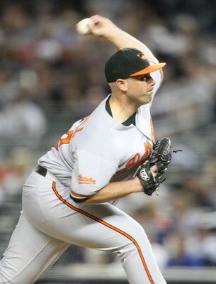 NEW YORK - MAY 21:  George Sherrill #52 of the Baltimore Orioles pitches against the New York Yankees on May 21, 2009 at Yankee Stadium in the Bronx borough of New York City.  (Photo by Nick Laham/Getty Images)