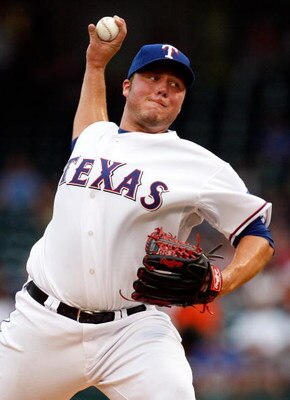 ARLINGTON, TX - JULY 27:  Pitcher Tommy Hunter #35 of the Texas Rangers throws against the Detroit Tigers on July 27, 2009 at Rangers Ballpark in Arlington, Texas.  (Photo by Ronald Martinez/Getty Images)