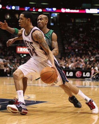 EAST RUTHERFORD, NJ - MARCH 04: Devin Harris #34 of the New Jersey Nets dribbles the ball against Stephon Marbury #8 of Boston Celtics during their game on March 4th, 2009 at The Izod Center in East Rutherford, New Jersey. NOTE TO USER: User expressly a
